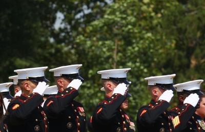 Group of US Marines salute