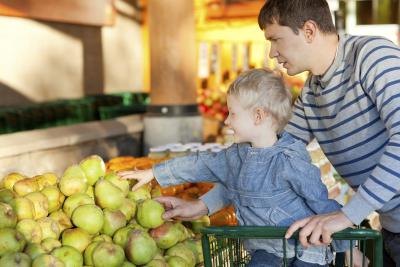 Father and son grocery shopping