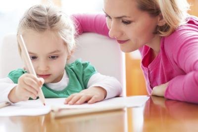 A teacher working with her student.