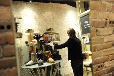 Shopper looking at Ugg boots in store