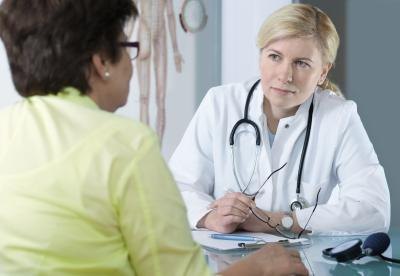 woman speaking with doctor