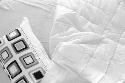 A fluffier comforter requires a couple extra inches to account for the loft of the filling.