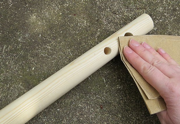 Sand holes to remove any splinters.