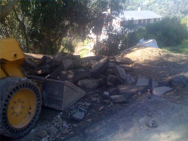 The break up and removal of old asphalt is very labor intensive. The break up and removal of old asphalt is very labor intensive.