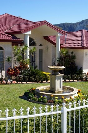 A well-landscaped front entrance adds curb appeal and value to a home. A well-landscaped front entrance adds curb appeal and value to a home.