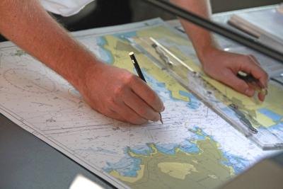 Cartographer marking up map Cartographer marking up map