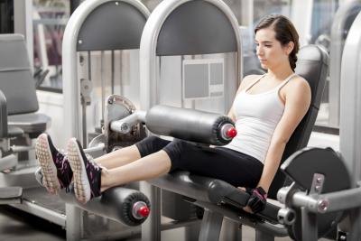 Woman on weight machine Woman on weight machine