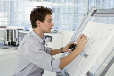Architect using draft table. Architect using draft table.