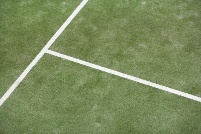Synthetic grass tennis courts offer easy upkeep and all-weather play. Synthetic grass tennis courts offer easy upkeep and all-weather play.