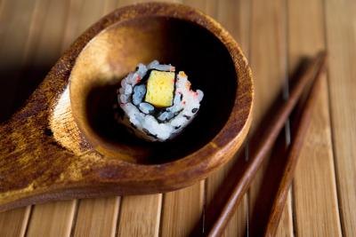 A piece of tofu sushi. A piece of tofu sushi.