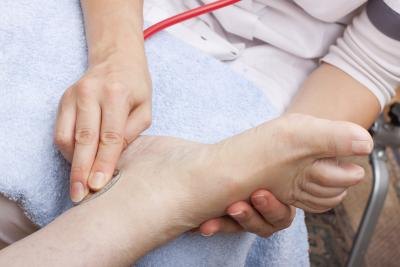 Doctor examining patients foot Doctor examining patients foot