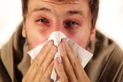 Young man suffering terribly from a sinus infection Young man suffering terribly from a sinus infection