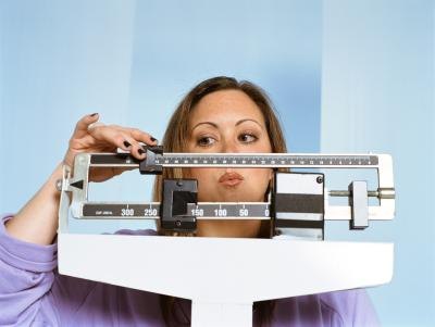 Woman on scale. Woman on scale.