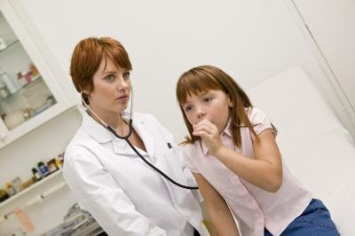 child coughing at doctor office child coughing at doctor office