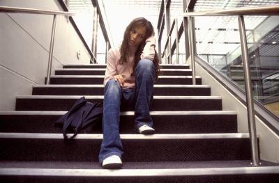 Teen girl sitting on stairs Teen girl sitting on stairs