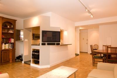 A golden oak floor in a modern living room with white walls. A golden oak floor in a modern living room with white walls.