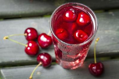 Tall glass of cherry juice. Tall glass of cherry juice.