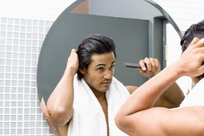 Man looking in mirror Man looking in mirror