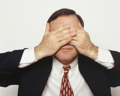 Man covering eyes Man covering eyes