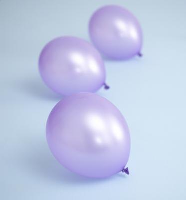 Three purple balloons. Three purple balloons.