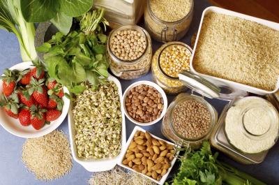 An overhead view of various types of rice, legumes, grains, fruits, vegetables and nuts. An overhead view of various types of rice, legumes, grains, fruits, vegetables and nuts.