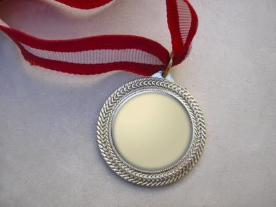 Award medal laying on table Award medal laying on table