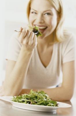 Woman eating a healthy meal Woman eating a healthy meal