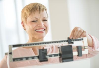 60 year old woman on scale 60 year old woman on scale