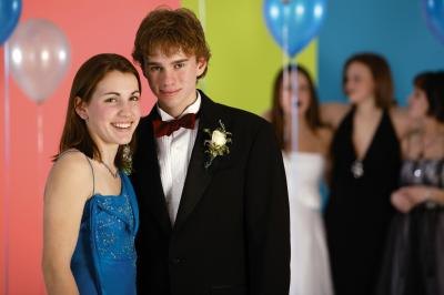 Students at a graduation dance. Students at a graduation dance.