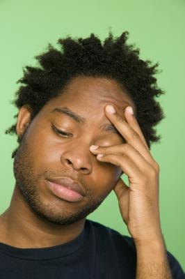 Man with pain in left side of head Man with pain in left side of head