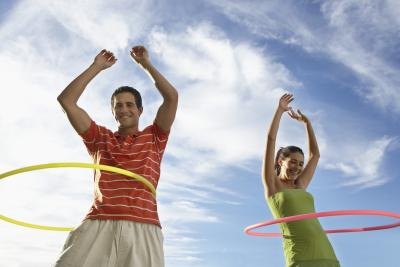 two friends hula hooping two friends hula hooping