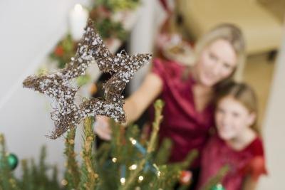 Mother and daughter looking at Christmas tree Mother and daughter looking at Christmas tree
