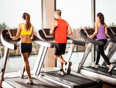 Group of people on treadmills. Group of people on treadmills.