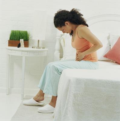 Woman with stomach pain. Woman with stomach pain.