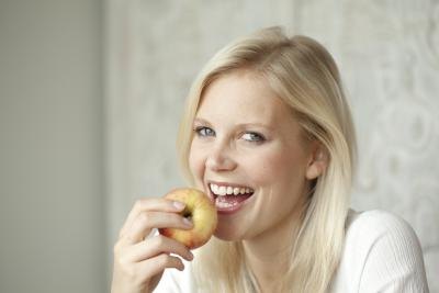 woman eating an apple woman eating an apple