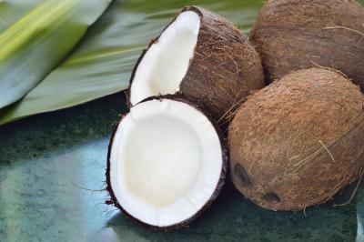 Whole and halved coconuts. Whole and halved coconuts.