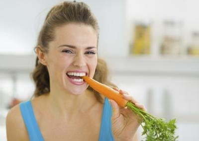 woman eating carrot woman eating carrot