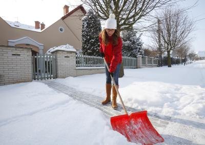 Woman shoveling snow Woman shoveling snow
