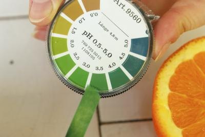 Testing the acidity in an orange Testing the acidity in an orange