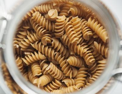 Bowl of uncooked whole wheat pasta Bowl of uncooked whole wheat pasta