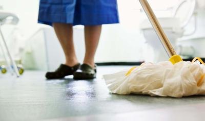 Woman mopping bathroom floor. Woman mopping bathroom floor.