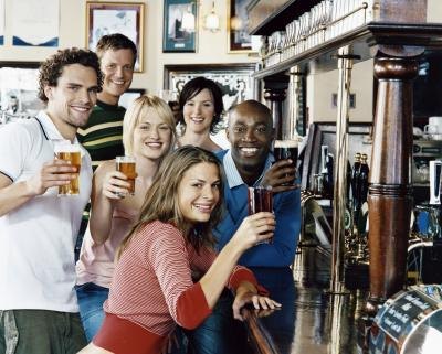 Friends enjoying a variety of beers Friends enjoying a variety of beers