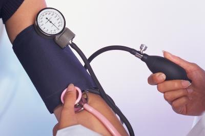 A doctor testing blood pressure. A doctor testing blood pressure.