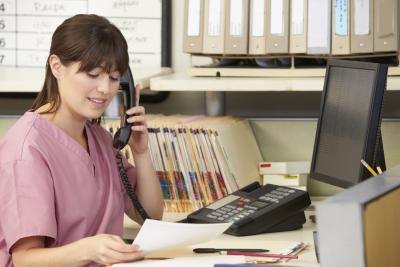 A medical front office worker handles administrative tasks. A medical front office worker handles administrative tasks.