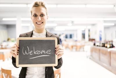 In some restaurants, a hostess also works as a cashier. In some restaurants, a hostess also works as a cashier.