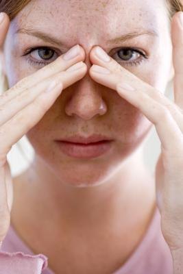 Woman holding nose Woman holding nose