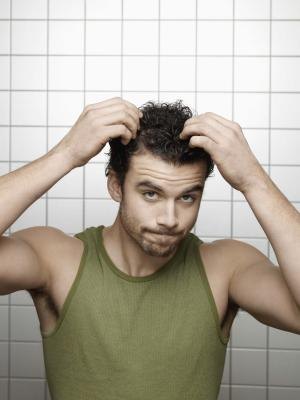 Man itching scalp Man itching scalp