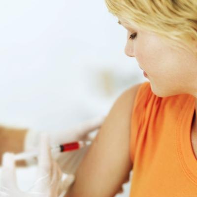 A doctor draws a patients blood. A doctor draws a patients blood.