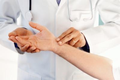 Doctor checking woman's pulse Doctor checking woman's pulse
