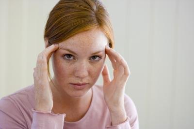 woman with hands on head woman with hands on head